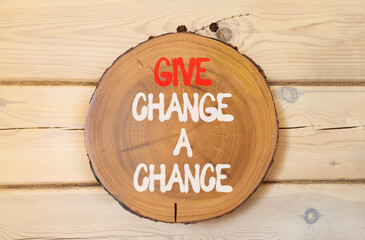 Give change a chance symbol. Concept words phrase Give change a chance on beautiful wooden circle....