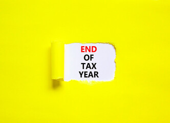 End of tax year symbol. Concept words phrase End of tax year on beautiful white paper. Beautiful...