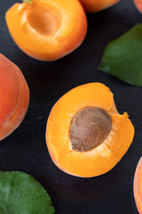 Fresh apricots on a black background. Top view.