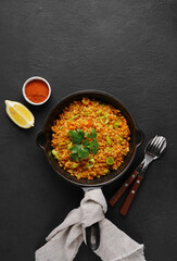 Bowl with red lentil with leek on black background. Vegan cuisine. top view , copy space