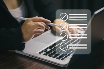 Close-up of hand using digital pen and typing on laptop with checklist icons overlay. Symbolizes task planning, productivity, to-do list, project management, and workflow organization.