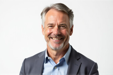 A man in a suit smiling for a picture