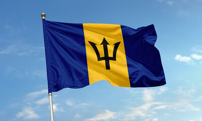 Barbados national flag with broken trident waving against the sky symbolizing independence and strength of the Caribbean nation