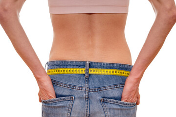 Closeup of Woman Wearing Jeans With Measuring Tape Around Waist, rear view