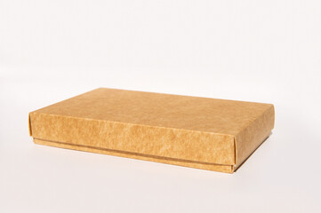 Rectangular brown cardboard box on white background for packaging and shipping