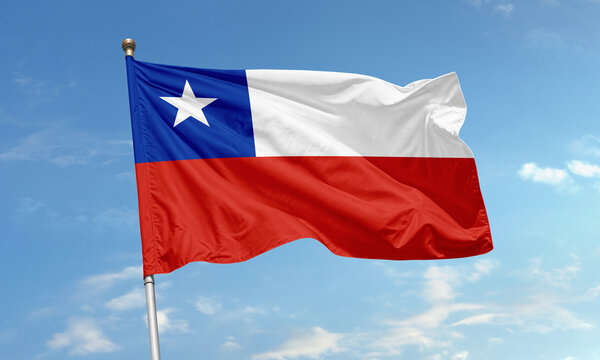 National flag of Chile waving in the wind with blue sky background