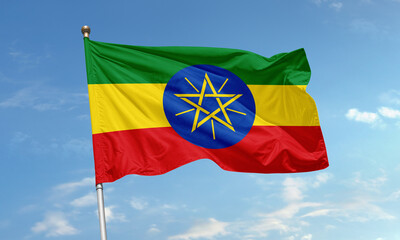 Ethiopian national flag with star emblem waving in the sky