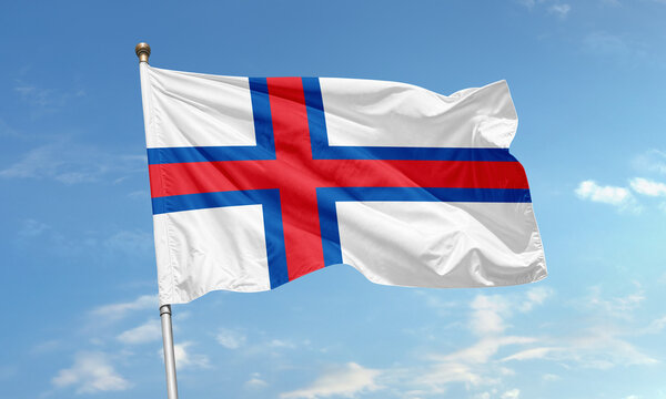 Faroe Islands flag with red and blue Nordic cross waving in sky - Powered by Adobe