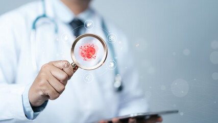 Cancer check concept. The doctor is holding a magnifying glass with Cancer cells icon to Medical check up breast, lungs, liver, colon, and cervical for Risk Assessment and disease diagnosis.