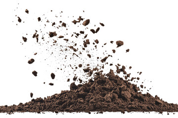 A mound of brown dirt with particles flying off of it against a black background in a studio shot
