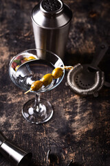 Traditional martini cocktail with olives and