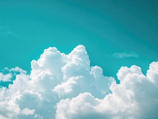 Plane flying through blue sky with clouds