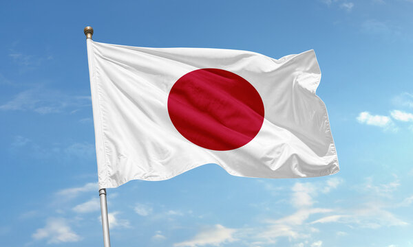Japanese national flag flying in blue sky