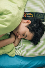 Teenager girl sleeping in bed during morning routines