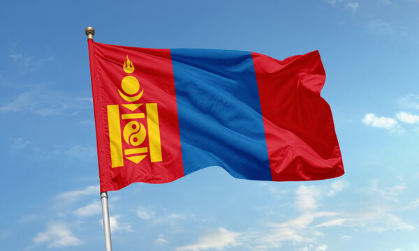 Mongolia national flag with Soyombo symbol waving in the clear blue sky