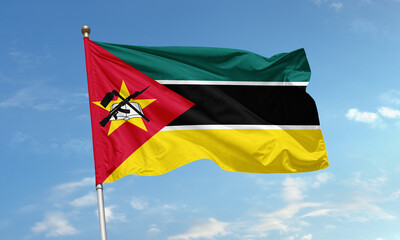 Flag of Mozambique waving with national emblem and symbolic color bands