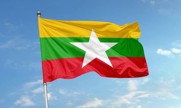 Waving flag of Myanmar with yellow, green, red stripes and white star