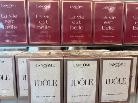 Kitsse, Austria - 25 May 2025: multiple lancome la vie est belle and idole perfume boxes displayed neatly on a retail store shelf. concept of cosmetics, retail, beauty industry.