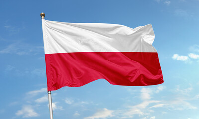 Poland national flag flying in clear sky