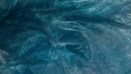 Blue organza fabric texture background.