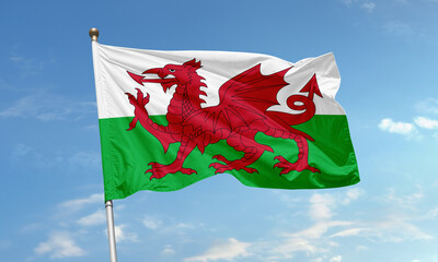 Welsh flag with red dragon flying in wind