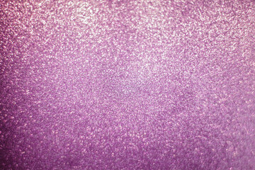 Abstract sparkly light purple background with soft glowing bokeh and shimmering texture