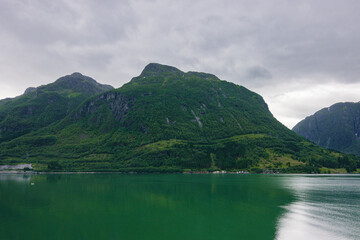 Beautiful town of Odda next to the fjord (Norway)