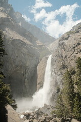 Yosemite National Park in California’s Sierra Nevada mountains aesthetic greenery landscape scenery on sunny day granite cliffs and waterfall