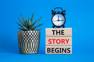 The Store Begins symbol. Concept words The Store Begins on wooden blocks. Beautiful blue background...