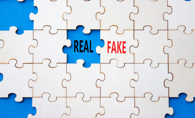 Fototapeta premium Real or Fake symbol. Concept word Real or Fake on wooden blocks. Beautiful blue background. Business and Real or Fake concept. Copy space