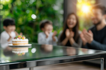 Serene Family Celebration: Contemporary Glass Table & Joyful Asian Family with Cake in Blurred Background, Minimalist Warmth.

