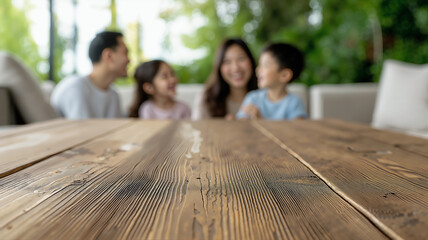 Warm Family Storytelling: Rustic Table & Blurred Asian Family Laughter in Minimalist, Low-Key Living Room, Copy Space.

