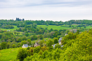 Panorama of the village and the verdant landscapes around Salins in the Cantal