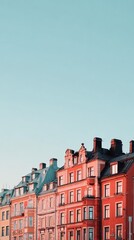 Fototapeta premium Colorful Historic Buildings Under a Clear Sky During Sunset in a European City