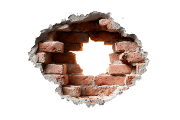 Brick wall with a hole revealing light in urban setting