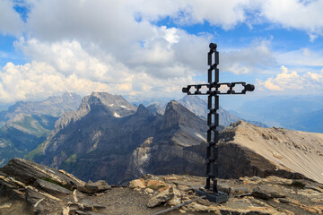 Mountain panorama with summits Grand Muveran, Petit Muveran, Dent Favre and summit cross of Dent de Morcles in Swiss Alps, Switzerland
