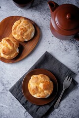 Profiteroles with cottage cheese filling in a plate