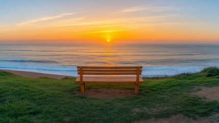 Wooden Bench Facing Ocean Sunset on Coastal Path