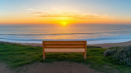 Wooden Bench Facing Ocean Sunset on Coastal Path