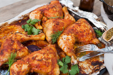 Top-down view of pub food: baked chicken drumsticks, rustic fries, sliced pickles, sauces, and beer. Cozy and casual atmosphere. Perfect for menus, blogs, or food delivery visuals