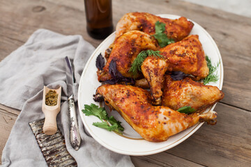 Top-down view of pub food: baked chicken drumsticks, rustic fries, sliced pickles, sauces, and beer. Cozy and casual atmosphere. Perfect for menus, blogs, or food delivery visuals