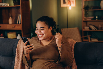 Plus size female expresses pure joy due to victory in online competition