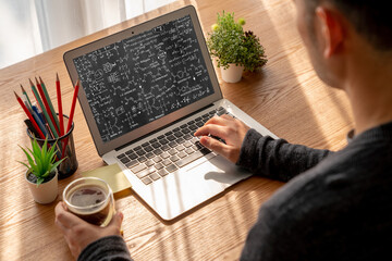 Mathematic equations and modish formula on computer screen showing concept of science and education
