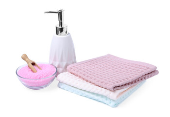 Clean waffle towels, soap and sea salt isolated on white