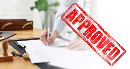 Man signing document at table in office and red stamp Approved, banner design