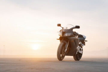 Obraz premium motorcycle on deserted road at sunset emphasizing details of its body