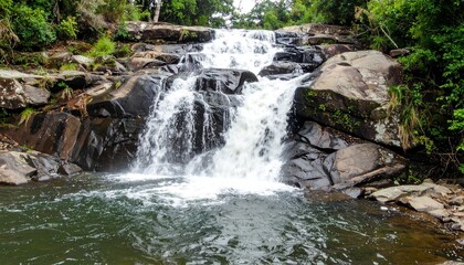 Fototapeta premium waterfall cascading down rocks