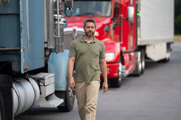 Transportation industry. Man driver near lorry truck. Truck driver. Trucking owner. Transportation...
