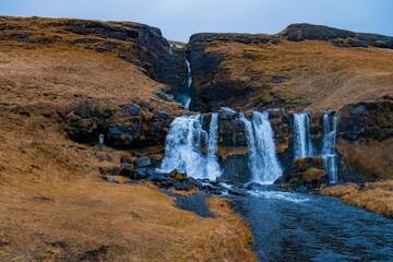 Hidden gem waterfall Gluggafoss in Icelandic landscape