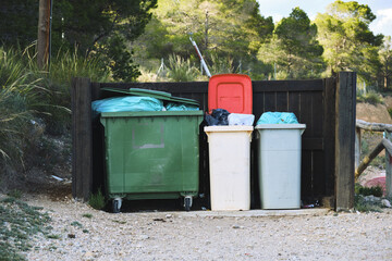 Outdoor recycling and waste bins in a natural park setting